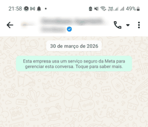 Conversa no WhatsApp com selo de empresa verificada e aviso de serviço seguro da Meta, exibido nas conversas pela API oficial